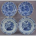 A pair of 18th century Dutch delft blue & white 9” plates with stylised floral decoration in lotus-