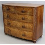 A 19th century figured mahogany bow-front chest, fitted two short & three long graduated drawers