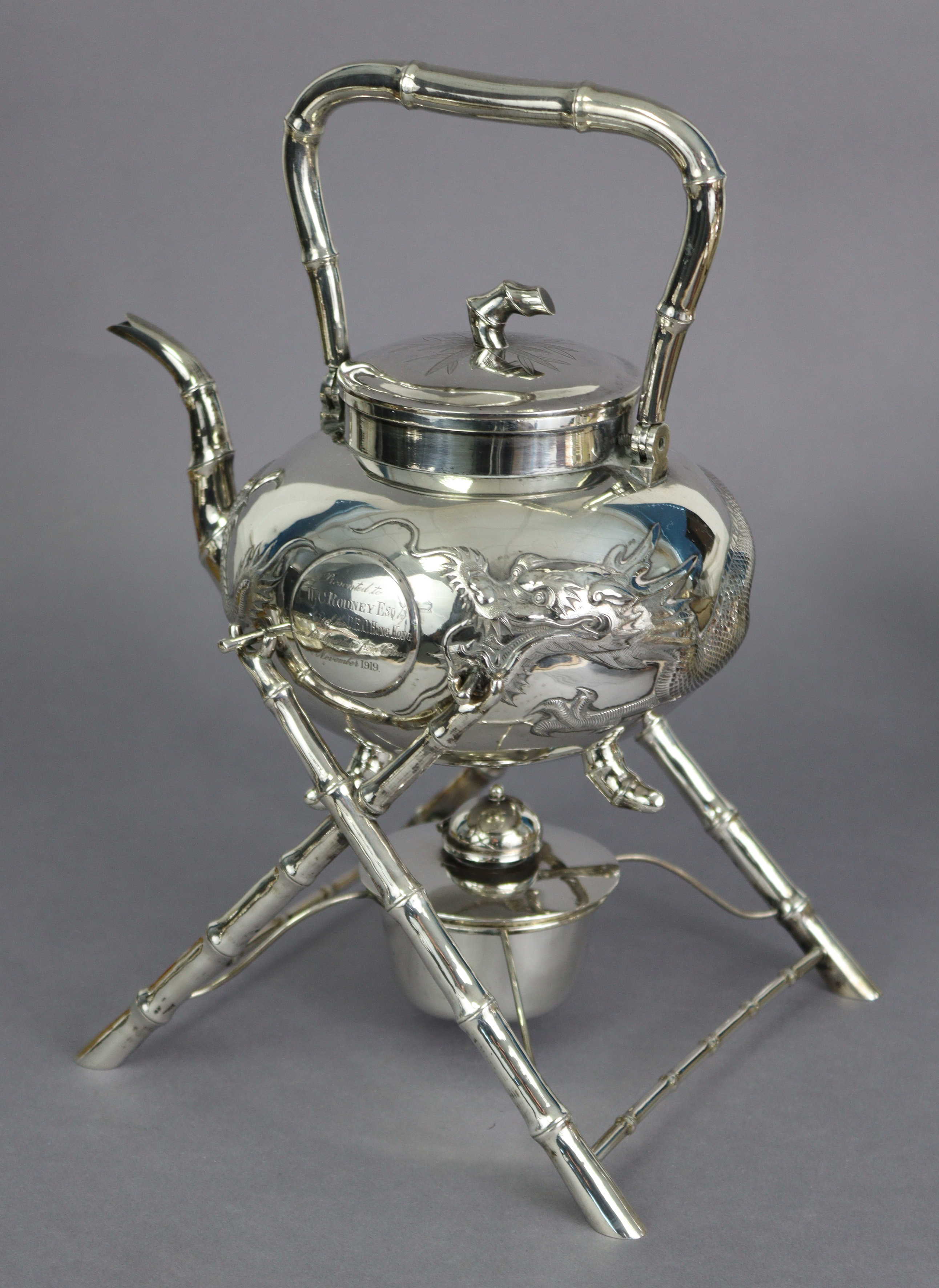 A CHINESE SILVER TEA KETTLE by KWONG MAN SHING, of compressed round form, embossed with an - Image 2 of 7