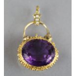 A Victorian amethyst pendant, the oval stone measuring approx. 18mm x 15mm x 9mm, set within a