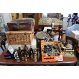 Two hampers; a brass table lamp; various items of plated cutlery; & sundry other items.