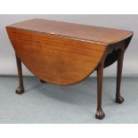 A late 19th century mahogany drop-leaf dining table, with oval top & on four round tapered legs with