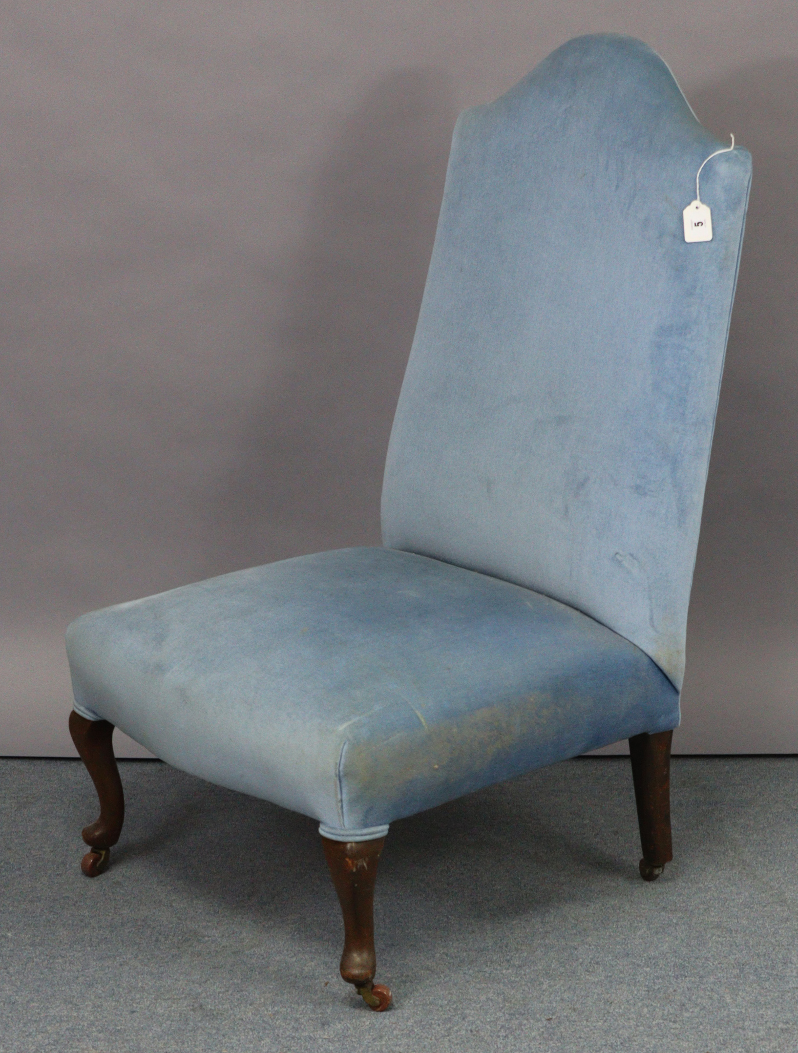 A matching nursing chair, on short cabriole legs & pad feet with ceramic castors.
