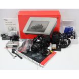 A Canon “EOS 450D” digital camera with lens; together with various other cameras; a light-box; & a