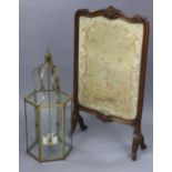 A brass-frame pendant hall lantern of six-sided form, 29” high; & a carved walnut frame