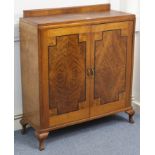 An inlaid-walnut side cabinet, fitted three shelves enclosed by pair of panel doors, & on short