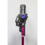 A Dyson “V6 Absolute” cordless vacuum cleaner, with charger, w.o.