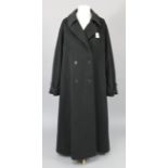 An Aquascutum of London black cotton ladies’ overcoat; together with three various rolls of