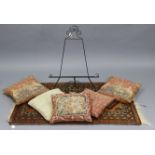 A small Persian pattern rug, 53” x 33”; together with five scatter cushions; & a wrought-iron