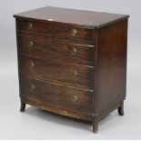 A reproduction mahogany small bow-front chest, fitted four long graduated drawers with brass ring