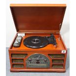 A retro-style turntable/cd player; together with a Sharp Solid State portable television /radio