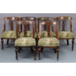A set of six Victorian Athenian-style carved oak dining chairs, with padded seats & on bulbous-