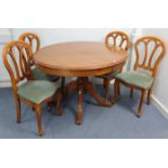A Younger’s cherry wood-finish extending pedestal dining table with moulded edge to the oval top,