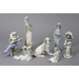 A collection of seven various Lladro Daisa & Nao ornaments, including Sitting Dog, Pierrot Girl,