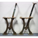 A pair of cast-iron bench end supports, 15” high; together with a table lamp; various items of