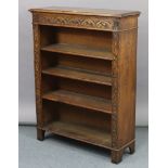 A carved oak standing open bookcase fitted three shelves, 36” wide x 46½” high.