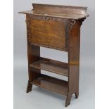 An Edwardian mahogany upright writing desk with fitted interior enclosed by hinged fall-front