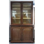 A late Victorian mahogany tall bookcase (lacking cornice), the upper part with four adjustable