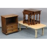 An oak nest of three rectangular occasional tables; together with an oak bedside cabinet; & a