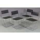 A set of four contemporary silvered-metal frame dining chairs with black metal-finish seats &
