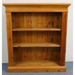 A pine standing open bookcase with two adjustable shelves, & on plinth base 38” wide x 42” high;