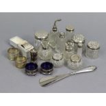 Eleven various cut-glass dressing table receptacles each with silver mount; together with three