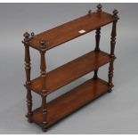 A set of Victorian walnut wall shelves of three open tiers, & with turned supports, 22½” wide x 20¾”