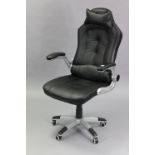 A modern swivel desk chair; & three folding chairs.