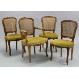 A continental-style carved beech frame carver dining chair inset woven-cane panel back, with