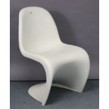 A Vitra white plastic “Panton Junior” chair.