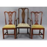 A pair of Chippendale-style dining chairs with pierced splat backs, padded drop-in seats & on square