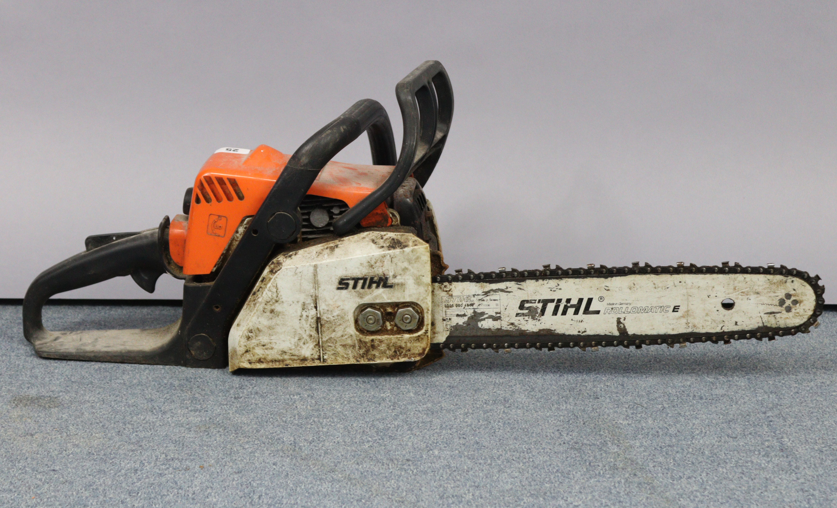 A Stihl “MS 180” petrol-driven chainsaw.