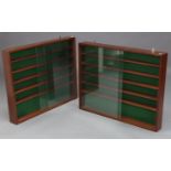 A pair of mahogany wall cabinets, each fitted five shelves enclosed by pair of glass sliding