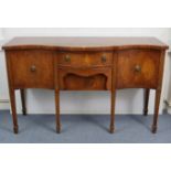 A regency-style inlaid-mahogany serpentine-front sideboard, fitted two long drawers to centre