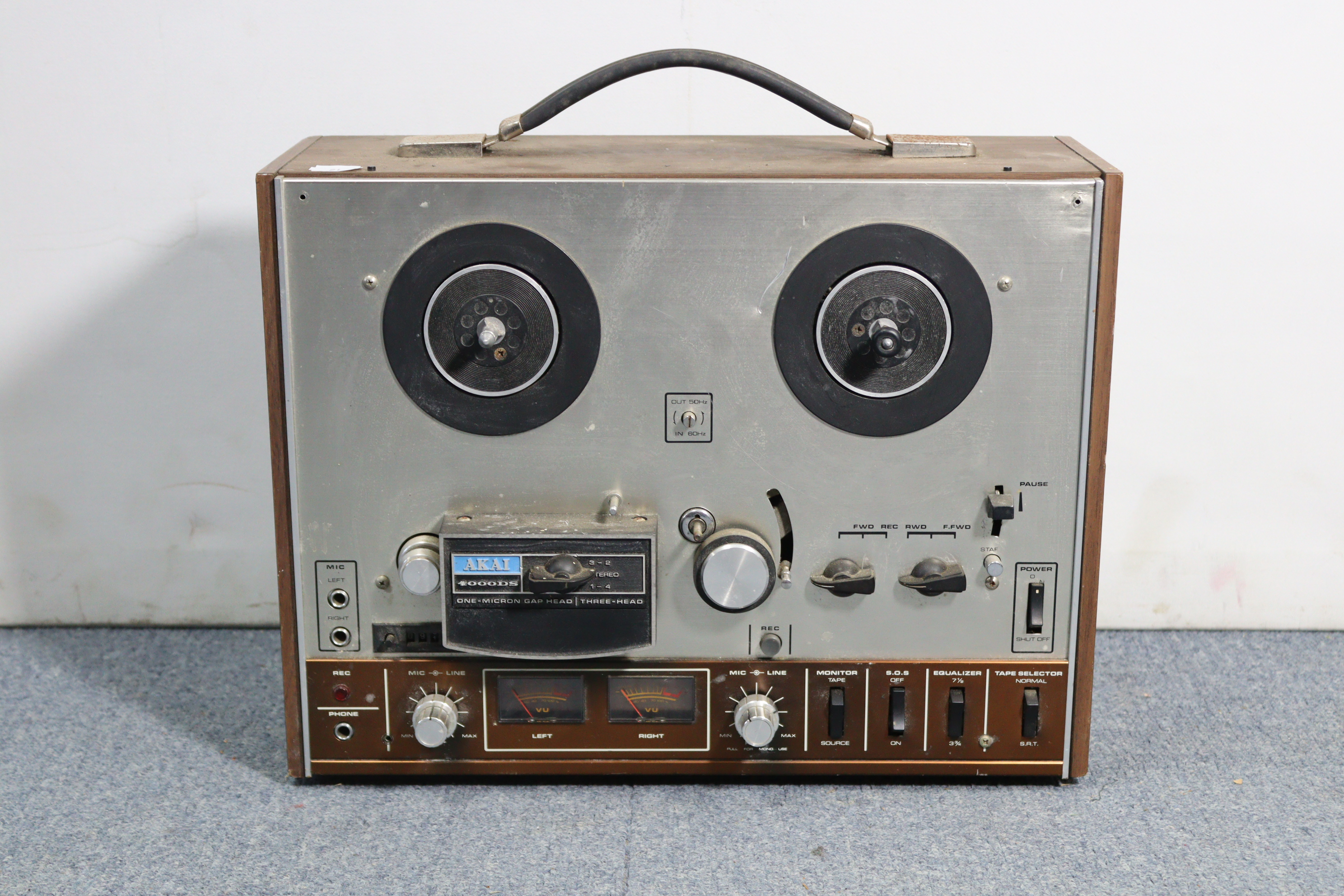 An Ever Ready “Sky Queen” transistor radio; a reel-to-reel tape recorder; a portable radio, etc.