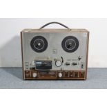 An Ever Ready “Sky Queen” transistor radio; a reel-to-reel tape recorder; a portable radio, etc.