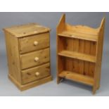 A pine three-drawer bedside chest on plinth base, 19” wide x 29” high; & a set of pine wall shelves,