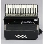 A Pearl River piano accordion in black polished case, & with carrying case.