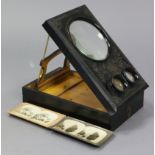 A late 19th/early 20th century ebonised & carved wooden graphoscope viewer, 14” x 8½”; & eighteen