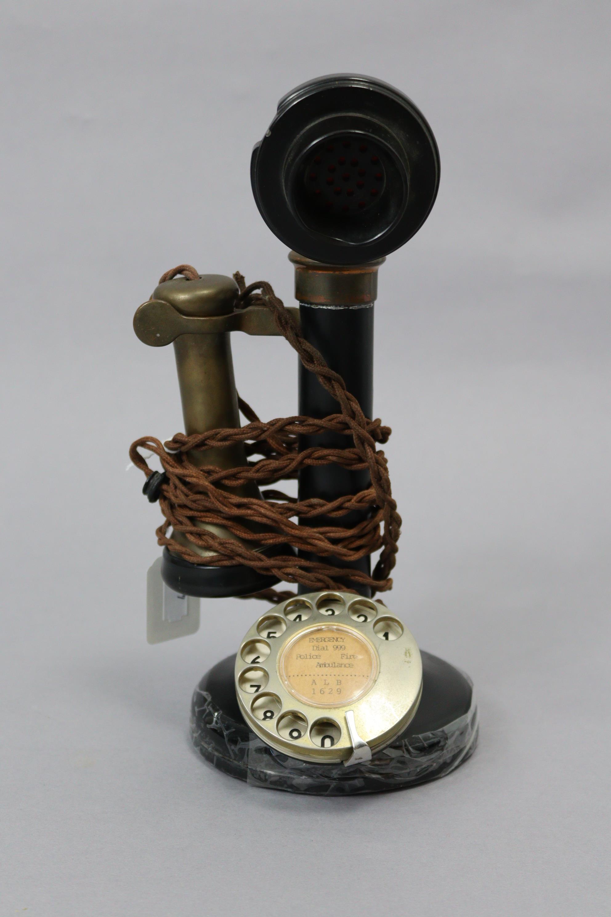 A mid-20th century candlestick telephone (Model No. 150), in black Bakelite case with brass & chrome - Image 2 of 2