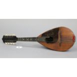 An early/mid-20th century inlaid-mahogany mandolin, 23½” long, bears label “J.G. Winder, London”,
