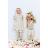 Two composition girl dolls, each with painted features, cloth body, & dressed, 17” & 14” high (w.a.