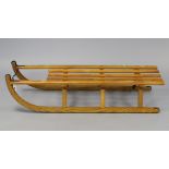 A German wooden sledge, 44½” long.