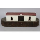 A painted wooden model Noah’s Ark”, 26” long; & various plastic animal models.