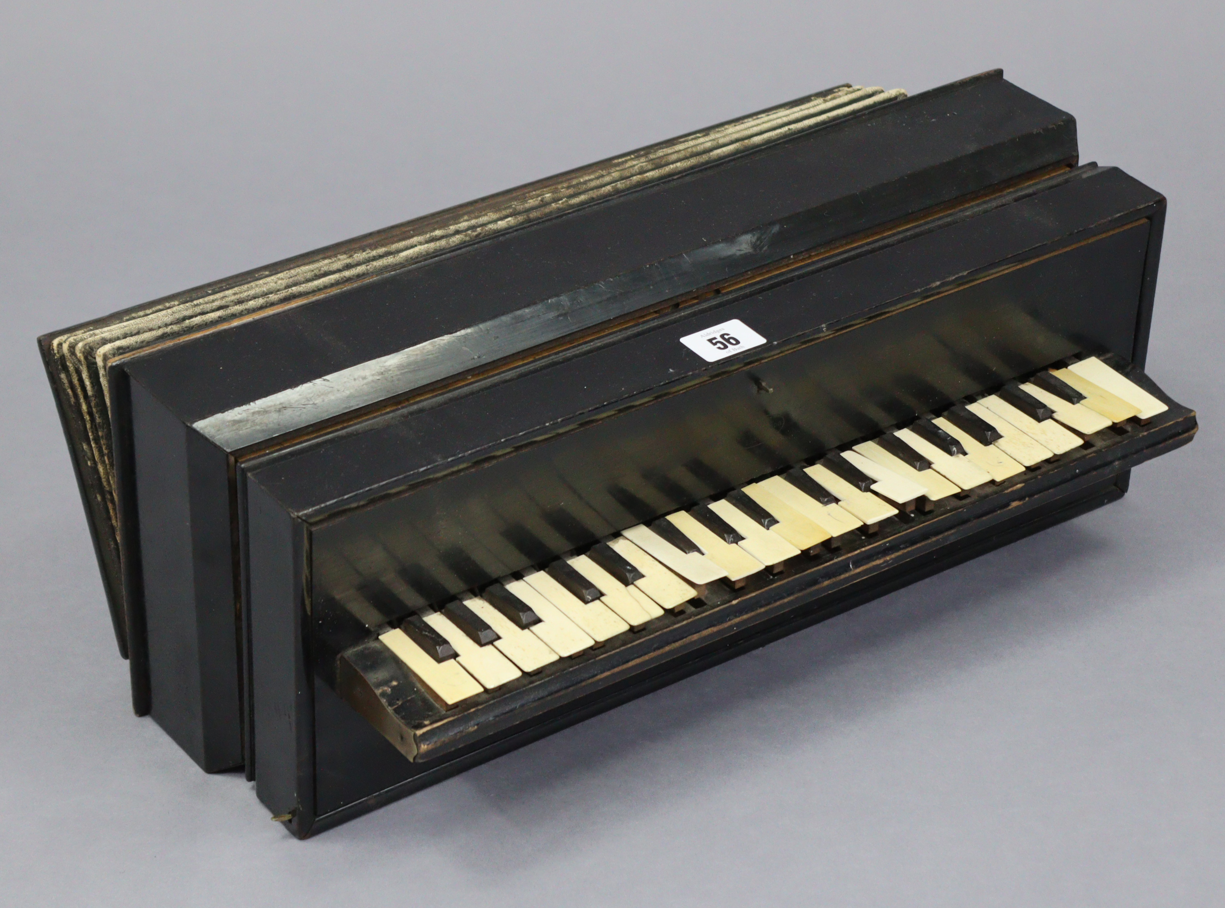 An early /mid-20th century Busson of Paris ebonised wooden accordion, 18¼” long.