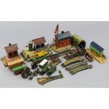 A collection of 1920’s Bing (German) tinplate railway buildings & accessories including a