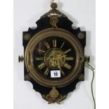 A French wall clock with skeleton movement, & in ebonised wooden case with gilt metal mounts, 13½”