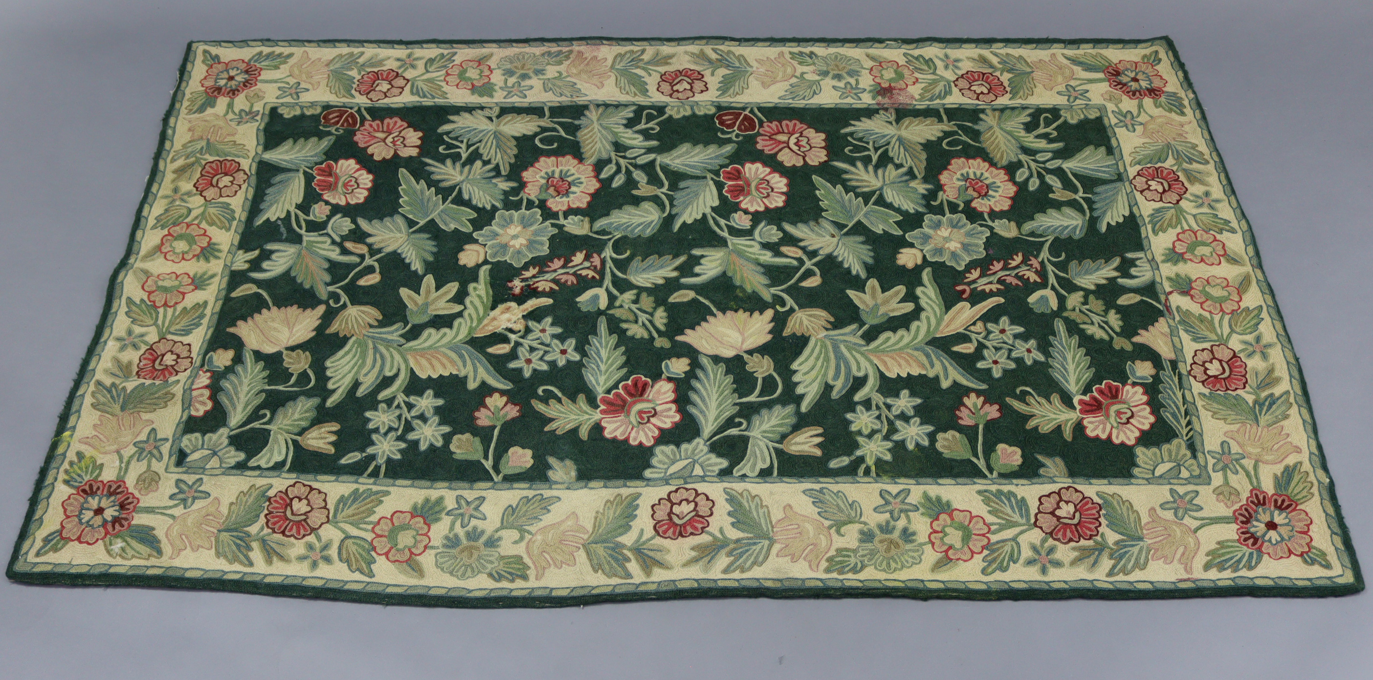 An Aubusson-type rug of green ground & with all-over multi-coloured foliate design, 63” x 39”;