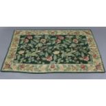 An Aubusson-type rug of green ground & with all-over multi-coloured foliate design, 63” x 39”;