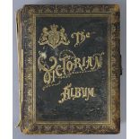 A Victorian gilt-tooled leather family photograph album titled “The Victorian Album” containing